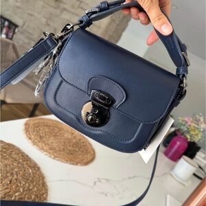 Steve Madden Navy Crossbody
Saddle Bag with black accents NWT